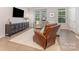 Bright and airy living room with modern furnishings, large windows, and neutral decor at 625 Uwharrie River Rd, Charlotte, NC 28211