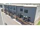 Townhome rear exterior features a balcony, gray siding, a garage, and an air conditioning unit at 625 Uwharrie River Rd, Charlotte, NC 28211
