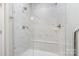 Sleek, modern shower with marble-patterned walls, glass enclosure, and built-in bench at 625 Uwharrie River Rd, Charlotte, NC 28211