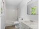 Well-lit bathroom features a shower/tub combination and a vanity with a sink at 6412 Sullins Rd, Charlotte, NC 28214