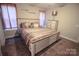 Serene bedroom featuring a comfortable bed, ceiling fan, and soft, neutral decor at 650 Harry St, China Grove, NC 28023