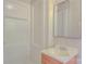 Bathroom showcasing a vanity, mirror, and shower with clean, white finishes at 6921 Idlewild Rd, Charlotte, NC 28212