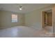 Spacious bedroom featuring tile flooring, a ceiling fan, and a closet area at 6921 Idlewild Rd, Charlotte, NC 28212