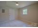 Bedroom featuring tile floors and a bright window at 6921 Idlewild Rd, Charlotte, NC 28212