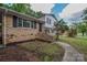 Charming two-story home featuring brick and siding with a well-manicured lawn and inviting front entrance at 6921 Idlewild Rd, Charlotte, NC 28212
