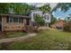 Charming two-story home featuring brick and siding with a well-manicured lawn and inviting front entrance at 6921 Idlewild Rd, Charlotte, NC 28212