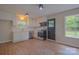 Bright kitchen featuring updated appliances, freshly painted walls, and brand new hardwood flooring at 6921 Idlewild Rd, Charlotte, NC 28212