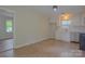 Bright kitchen featuring updated appliances, freshly painted walls, and brand new hardwood flooring at 6921 Idlewild Rd, Charlotte, NC 28212