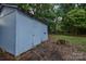 Outbuilding in a spacious backyard, providing additional storage or workshop space at 6921 Idlewild Rd, Charlotte, NC 28212