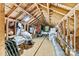 Spacious attic offering ample storage solutions with exposed wooden beams and a small window at 6992 Sherrills Ford Rd, Sherrills Ford, NC 28673