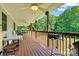 Relaxing back porch featuring outdoor seating, a grill, and views of the surrounding lush greenery at 6992 Sherrills Ford Rd, Sherrills Ford, NC 28673