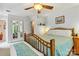 Comfortable bedroom with a cozy bed, ample natural light, and convenient access to closet and adjoining bathroom at 6992 Sherrills Ford Rd, Sherrills Ford, NC 28673