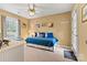 Relaxing bedroom with ceiling fan, window seat, comfortable bed, and neutral color palette at 6992 Sherrills Ford Rd, Sherrills Ford, NC 28673