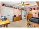 Comfortable bedroom featuring a ceiling fan, shelves with decor, and closet for ample storage at 6992 Sherrills Ford Rd, Sherrills Ford, NC 28673