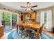 Dining area boasts hardwood floors, natural light, and easy access to outdoor spaces through sliding glass doors at 6992 Sherrills Ford Rd, Sherrills Ford, NC 28673
