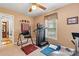 Home gym with carpet, ceiling fan, workout equipment, and window providing natural light at 6992 Sherrills Ford Rd, Sherrills Ford, NC 28673