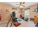 Home gym with workout equipment, carpet flooring, ceiling fan, and natural light at 6992 Sherrills Ford Rd, Sherrills Ford, NC 28673