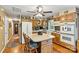 Functional kitchen features an island, oak cabinetry, and modern appliances, seamlessly flowing to other living spaces at 6992 Sherrills Ford Rd, Sherrills Ford, NC 28673