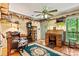 Charming living room with hardwood floors, an area rug, a ceiling fan, and lots of décor at 6992 Sherrills Ford Rd, Sherrills Ford, NC 28673