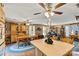 Open-concept living space with hardwood floors, oak cabinetry, and a connecting dining area for easy entertaining at 6992 Sherrills Ford Rd, Sherrills Ford, NC 28673