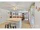 The living space features an eat-in dining room, an entertainment area, wood-look floors, and access to the kitchen at 6992 Sherrills Ford Rd, Sherrills Ford, NC 28673