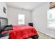 The cozy bedroom features neutral walls, plush carpeting, and a large window at 720 Herlong S Ave, Rock Hill, SC 29732