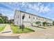 Side view of modern townhomes with attached garages, set on a manicured lawn and next to a paved street at 720 Herlong S Ave, Rock Hill, SC 29732