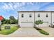 Modern townhome with a white exterior and attached garage with a well-manicured lawn at 720 Herlong S Ave, Rock Hill, SC 29732
