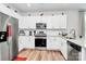 Bright kitchen with stainless appliances, modern backsplash, and ample storage at 720 Herlong S Ave, Rock Hill, SC 29732