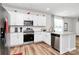 Modern kitchen featuring white cabinets, stainless steel appliances, and granite countertops at 720 Herlong S Ave, Rock Hill, SC 29732