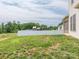 Grassy backyard showcasing a white fence and mature trees, offering a private outdoor space at 805 Old Little Rock Rd, Charlotte, NC 28214