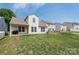Spacious backyard featuring a well-maintained lawn and a view of neighboring homes at 805 Old Little Rock Rd, Charlotte, NC 28214
