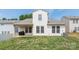Backyard with lawn and back of the house featuring siding, windows, and patio space with furniture and a grill at 805 Old Little Rock Rd, Charlotte, NC 28214