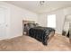 Comfortable bedroom featuring soft carpet, natural light, and a well-made bed with a furry blanket at 805 Old Little Rock Rd, Charlotte, NC 28214