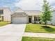 Charming single-Gathering home with stone accents, a well-manicured lawn, and a paved driveway leading to a garage at 805 Old Little Rock Rd, Charlotte, NC 28214