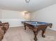 Game room with pool table, carpeted floors and tan sectional sofa at 805 Old Little Rock Rd, Charlotte, NC 28214
