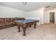 Game room featuring a pool table, tan sectional sofa, and carpet at 805 Old Little Rock Rd, Charlotte, NC 28214