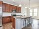 Kitchen boasts granite counters, wood cabinets, and a stainless-steel microwave at 805 Old Little Rock Rd, Charlotte, NC 28214