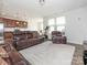 An open-concept living room features wood floors and a large white area rug at 805 Old Little Rock Rd, Charlotte, NC 28214