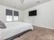 This main bedroom offers a calm palette and great natural light at 805 Old Little Rock Rd, Charlotte, NC 28214