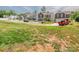 Street view of a residential neighborhood with well-kept lawns and various home styles at 805 Old Little Rock Rd, Charlotte, NC 28214