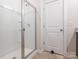 Bathroom featuring a glass enclosed shower with a white door at 805 Old Little Rock Rd, Charlotte, NC 28214
