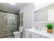 Bathroom showcasing shower with glass doors and vanity with modern fixtures at 8611 Earthenware Dr, Charlotte, NC 28269
