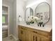Bathroom featuring double vanity, modern mirrors, and tile floor at 8611 Earthenware Dr, Charlotte, NC 28269