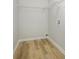 Walk-in closet with wood-look flooring and wire shelving, offering practical storage solutions at 8611 Earthenware Dr, Charlotte, NC 28269