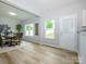 Bright dining area featuring a door that leads to the backyard and an open dining area at 8611 Earthenware Dr, Charlotte, NC 28269