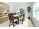 Inviting dining room with natural light and direct access to a living area at 8611 Earthenware Dr, Charlotte, NC 28269