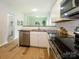 Modern kitchen view showcases stainless steel appliances, granite countertops and wood-look flooring at 8611 Earthenware Dr, Charlotte, NC 28269