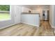 Bright kitchenette with stainless steel appliances, white cabinetry and convenient access to backyard at 8611 Earthenware Dr, Charlotte, NC 28269
