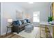 Cozy living room featuring stylish furniture, soft lighting, and wood-look flooring at 8611 Earthenware Dr, Charlotte, NC 28269